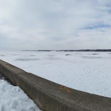 Still snow and ice in the lake and on the beach